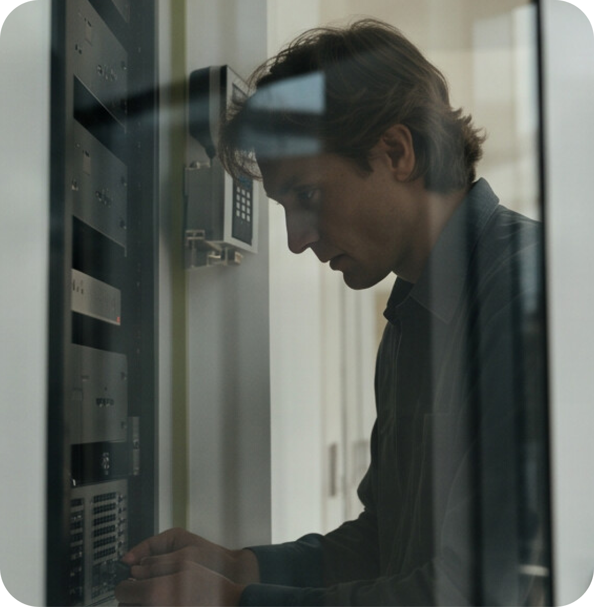 Technician installing access control equipment in a commercial facility